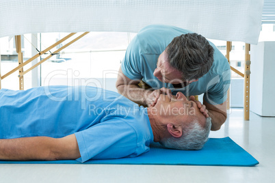 Paramedic performing resuscitation on patient