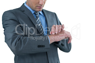 Businessman pretending to check wrist watch