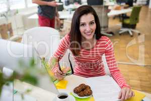 Female graphic designer sitting at desk