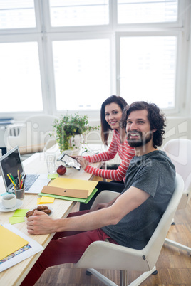 Graphic designers working at desk