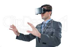 Businessman using virtual reality headset against white background