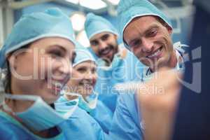 Team of surgeons having discussion in operation theater
