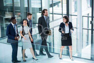 Businesswomen walking with colleagues