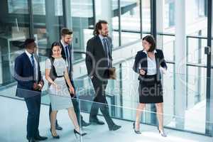 Businesswomen walking with colleagues