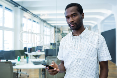 Portrait of graphic designer using mobile phone