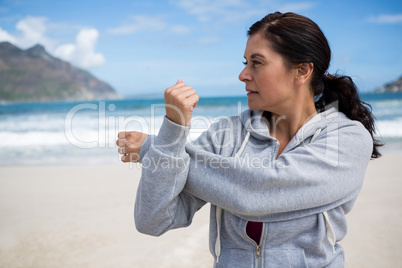 Mature woman performing stretching exercise