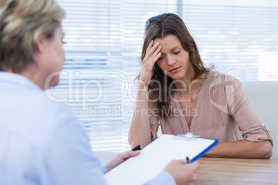 Tense patient consulting a doctor