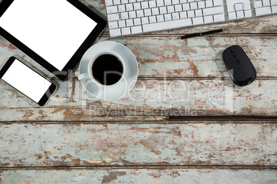 Digital tablet, smartphone, keyboard with mouse and coffee cup