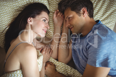 Romantic couple relaxing on bed Romantic couple relaxing on bed