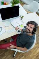 Business executive having coffee at his desk