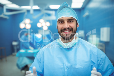 Portrait of male surgeon smiling in operation theater