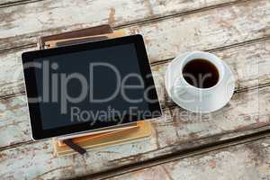 Organiser with digital tablet and coffee