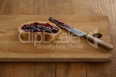 Bread with jam and knife