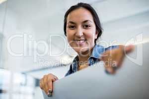 Smiling graphic female designers at desk