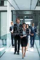 Businesswoman walking with colleagues