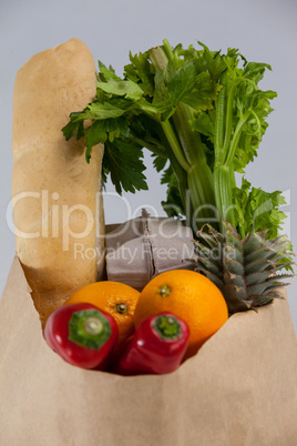 Fruits and vegetables in brown grocery bag