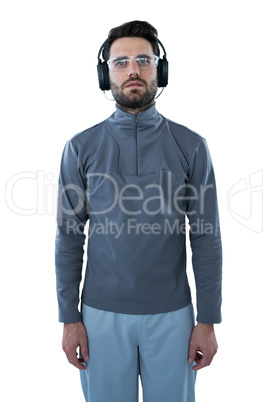 Man wearing protective glasses listening to headphones