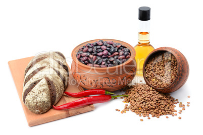 Bread, lentils, beans and vegetable oil isolated on white backgr