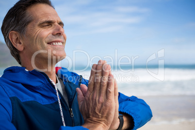 Mature man performing yoga