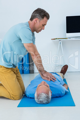 Paramedic performing resuscitation on patient