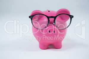 Close-up of piggy bank with spectacles