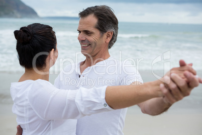 Romantic couple dancing on beach
