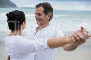 Romantic couple dancing on beach