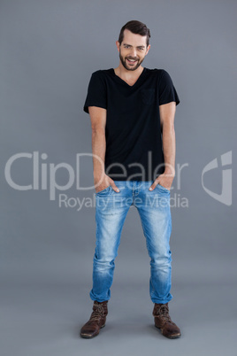 Portrait of a man in black t-shirt and blue jeans