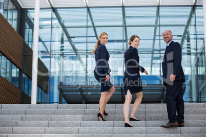 Businesspeople climbing up the stairs