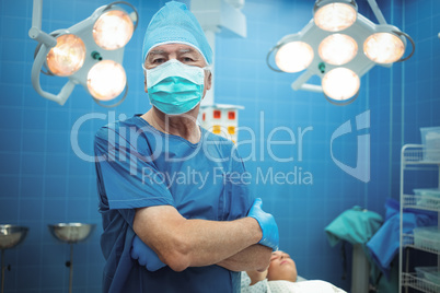 Portrait of male surgeon standing in operation theater