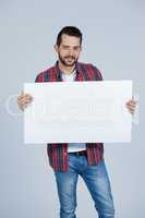 Man holding a blank placard