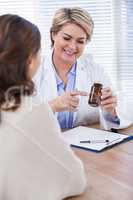 Female doctor explaining medicine to patient