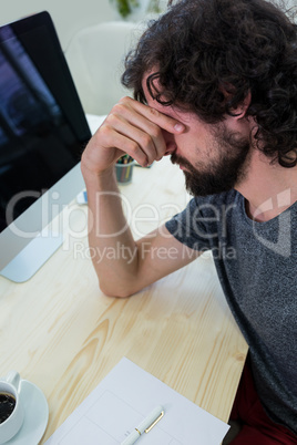 Stressed business executive at his desk