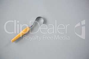 Cheese cutting tool on grey background