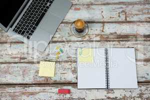 Laptop and coffee cup with diary