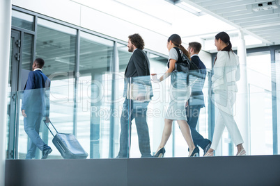 Businesspeople walking in office