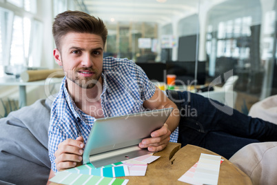 Graphic designers holding digital tablet