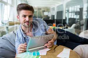 Graphic designers holding digital tablet