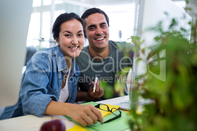 Graphic designers working at desk