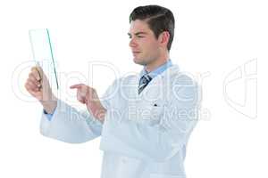 Male doctor using an futuristic digital tablet