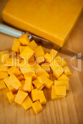 Cubes of cheese with knife