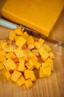 Cubes of cheese with knife