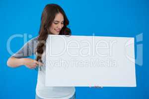 Woman holding a blank placard