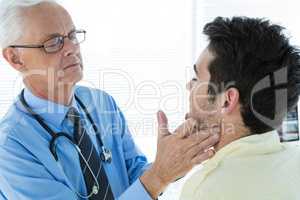 Doctor examining patient jaw