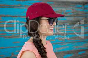 Woman in red cap and sunglasses
