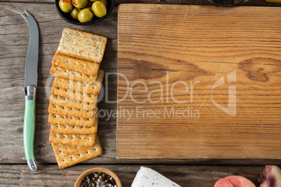 Crackers biscuits, ingredients and chopping board