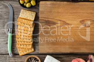 Crackers biscuits, ingredients and chopping board