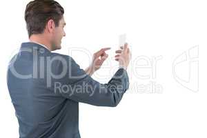 Businessman using futuristic mobile phone