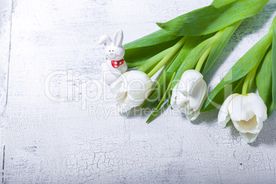 White tulips on wooden table