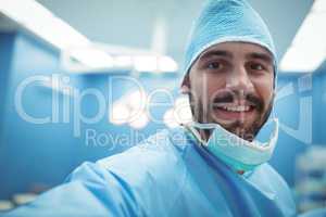Portrait of male surgeon smiling in operation theater